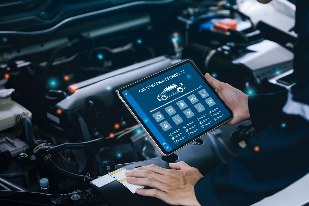 Technician performing OBD-II emissions test